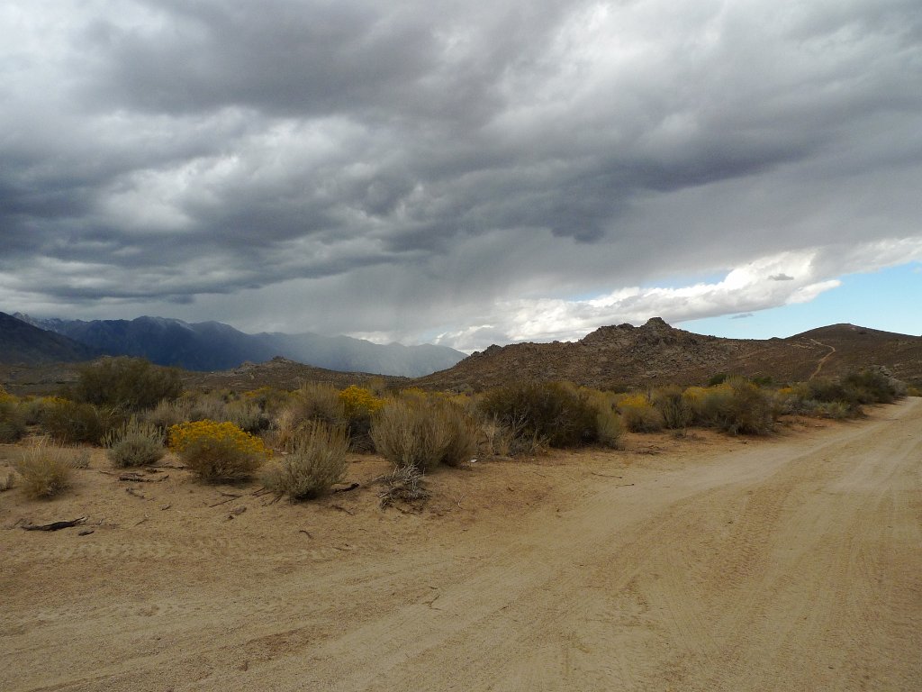 California-Fall2010 362.JPG - Buttermilk road from Bishop. I realized that as I was packing everything for Larry (so that he doesn't forget his rain jacket like the last time), I left home few things of my own - my knit had and my rainjacket. We stopped at the outdoors store in Bishop, and they just happen to have a rain jacket matching the color of my shirt. Of course they made a sale! With this weather ahead of us, I didn't want to be without a waterproof shell.